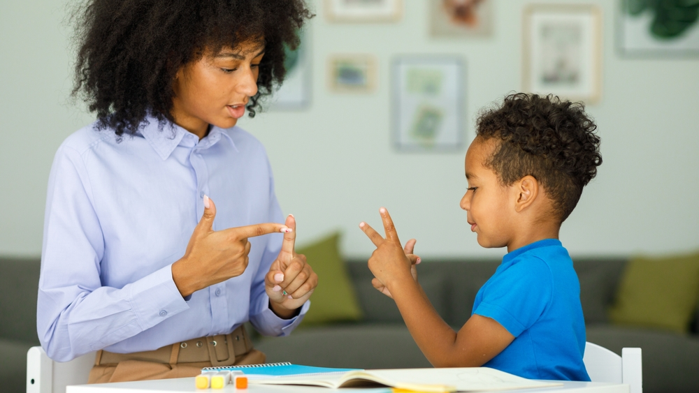 Hands conducting standardized assessments